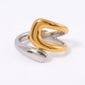 The Merge Ring in gold and silver on a pure white background